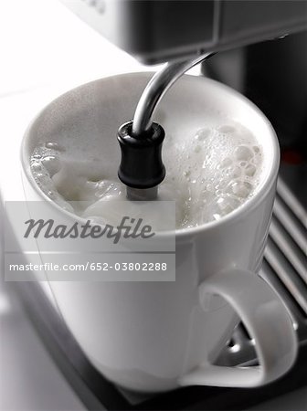 Heating a cup of milk with a percolator