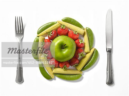 Plate-shaped composition with vegetables and fruit