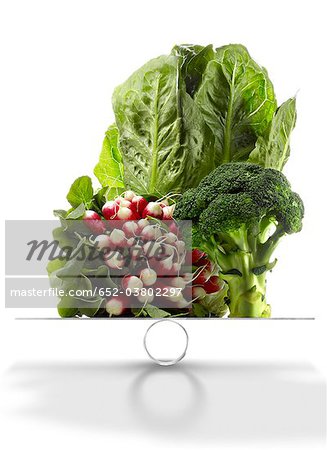 Assorted vegetables on scales Assorted vegetables on scales