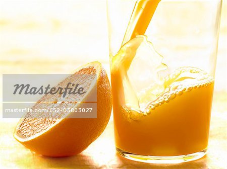 Pouring a glass of orange juice