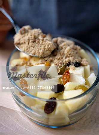 Preparing an apple and raisin crumble