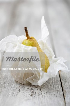 Pear wrapped in silk paper