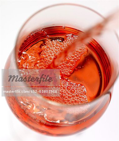 Serving a glass of rosé wine