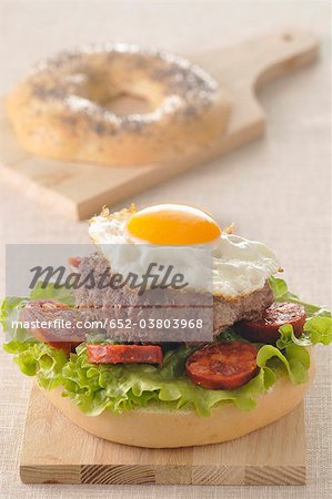 Hamburger,fried egg and Chorizo bagel burger
