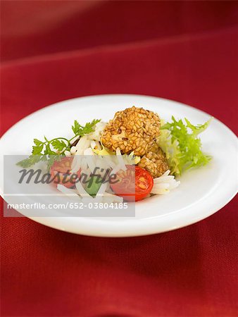 Sauteed rice and chicken coated with pine nuts