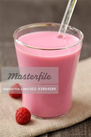 Glass of milk with raspberry cordial