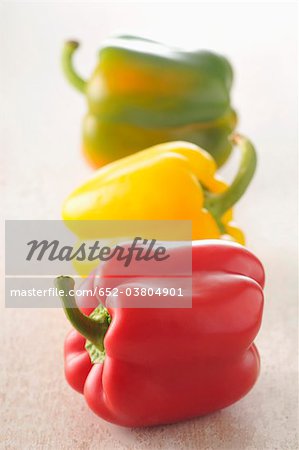 Three different colored peppers