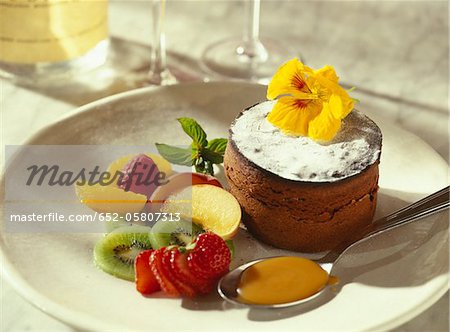Individual chocolate cake with fresh fruit salad