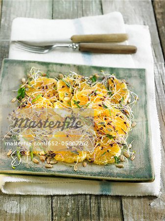 Tangerine fruit salad with red cabbage sprouts,luzerne and sunflower seeds