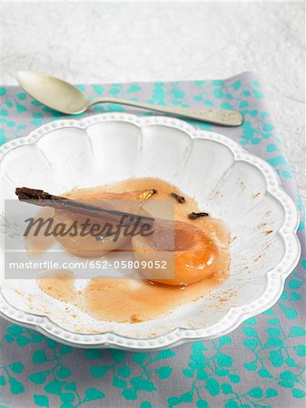 Stewed pears with grape jelly,cloves and cinnamon