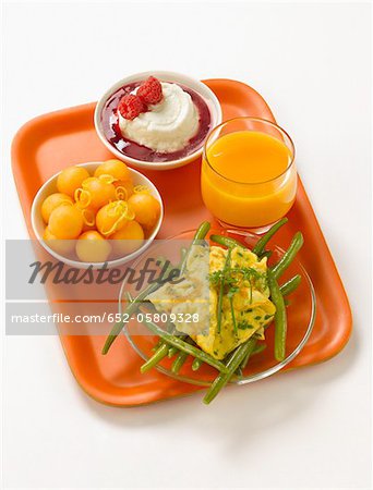 T.V dinner tray with melon,omelette with green beans,yoghurt with raspberry puree