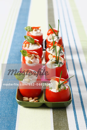 Small raw tomatoes stuffed with roquefort cream and almonds Small raw tomatoes stuffed with roquefort cream and almonds