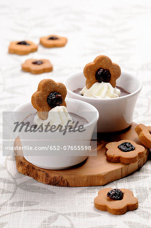 Chocolate cream dessert with cream and cookies