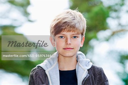 Portrait Of A Serious Adolescent Boy Stock Photo Masterfile