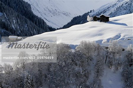 Winter Landscape Of Mountain With Log Cabins Stock Photo