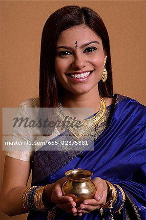 Indian woman holding offering