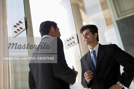 India, Two businessmen in suits talking