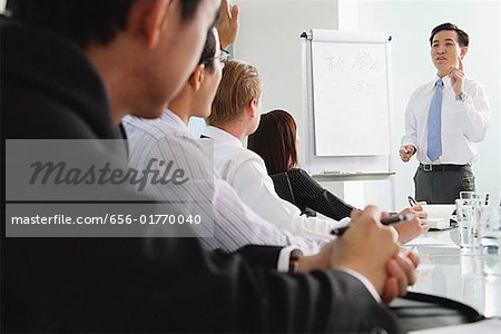 Businessman presenting to other executives