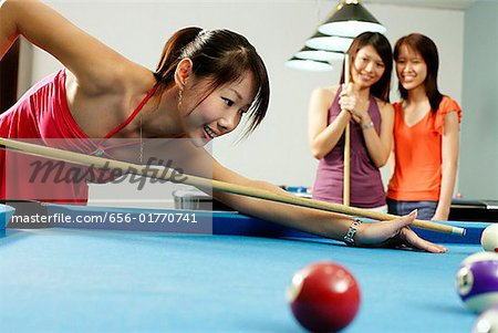 Women playing pool