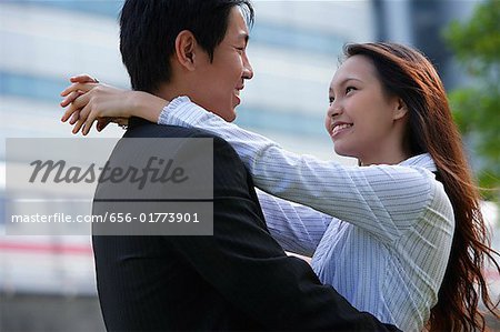 Couple looking at each other, embracing