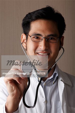 head shot of male doctor with stethoscope