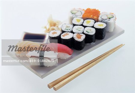 Assorted sushi on white platter