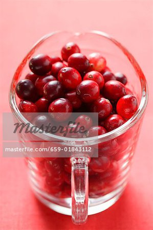 Cranberries in glass jug
