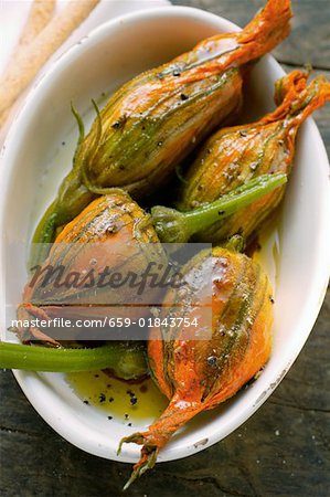 Marinated stuffed courgette flowers