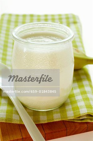 Jar of yoghurt and fresh banana