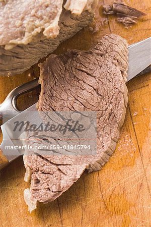 Boiled beef with a slice carved