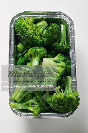 Steamed broccoli in an aluminium container