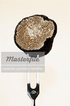 Half a truffle on a meat fork