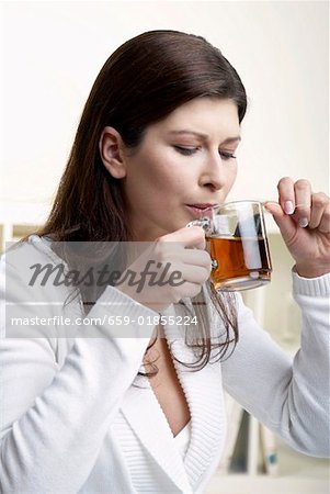 Woman drinking a cup of tea