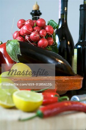 Assorted vegetables and lemons in a bowl