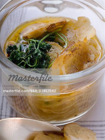 Pretzel soup with onions and deep fried parsley