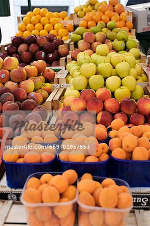 Fruit stall with apricots, peaches, apples, oranges