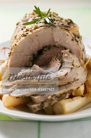 Roast turkey roll with root vegetables and herbs