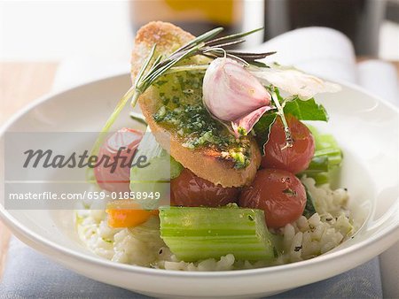 Risotto with vegetables, crostini pesto and rosemary