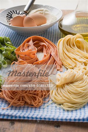 Various types of home-made pasta with ingredients