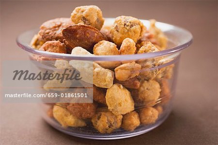 Mixed nuts to nibble in glass bowl