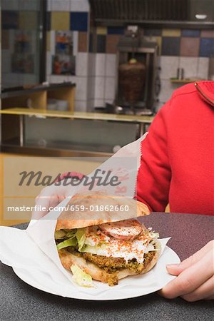 Pita bread filled with falafel in a snack bar