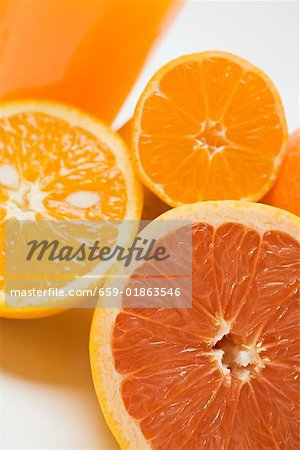 Glass of orange juice, grapefruit and oranges