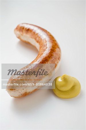 Sausage (bratwurst) with mustard on white background Sausage (bratwurst) with mustard on white background