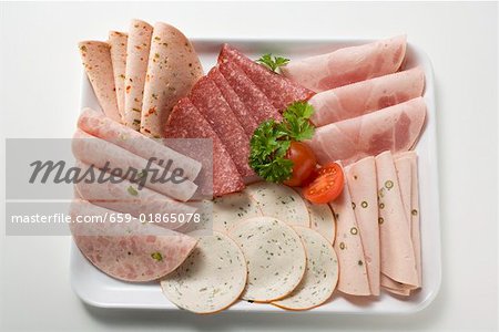 Cold cuts platter with cherry tomatoes and parsley