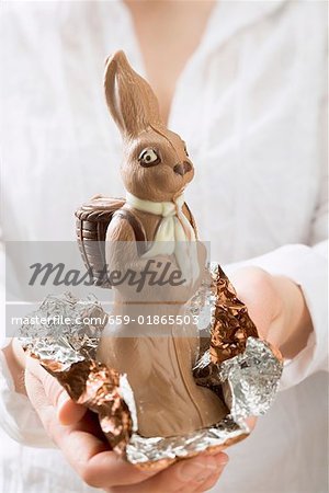 Woman holding chocolate Easter Bunny