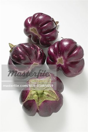 Four round aubergines