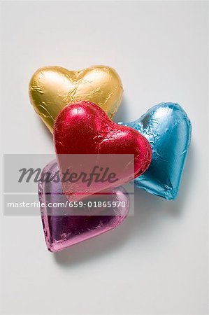 Four chocolate hearts in coloured foil