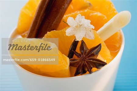 Orange slices with star anise, lemon grass & sugared flower