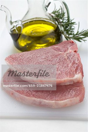 Two pork chops, olive oil, rosemary