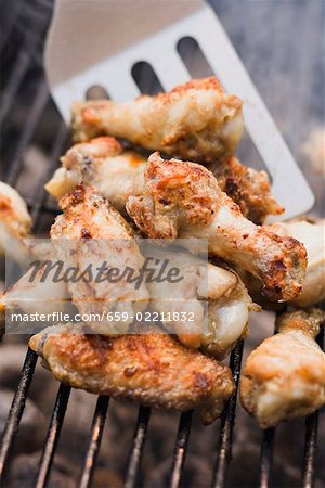 Chicken wings on a barbecue